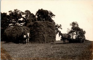 Postcard RPPC Real Photo Men Stacking Hay in Horse-Drawn Carts C.1910 L9