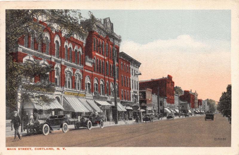 CORTLAND NEW YORK MAIN STREET~OLD CARS~WOLCOTTS CASH MARKET POSTCARD 1918