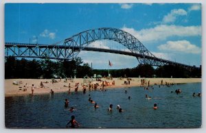 Bourne Massachusetts~Scenic Park Beach~Cape Cod Canal~Bridge~Flag~1950s Postcard