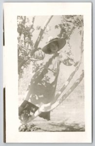 RPPC Lovely Lady Woman Sitting in Tree Large Straw Hat c1910 Photo Postcard J25