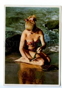 496189 East Germany GDR girl swimsuit at sea with seaweed hands Old postcard