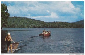 Water skiing behind a speed boat over beautiful mountain lakes, 40-60s