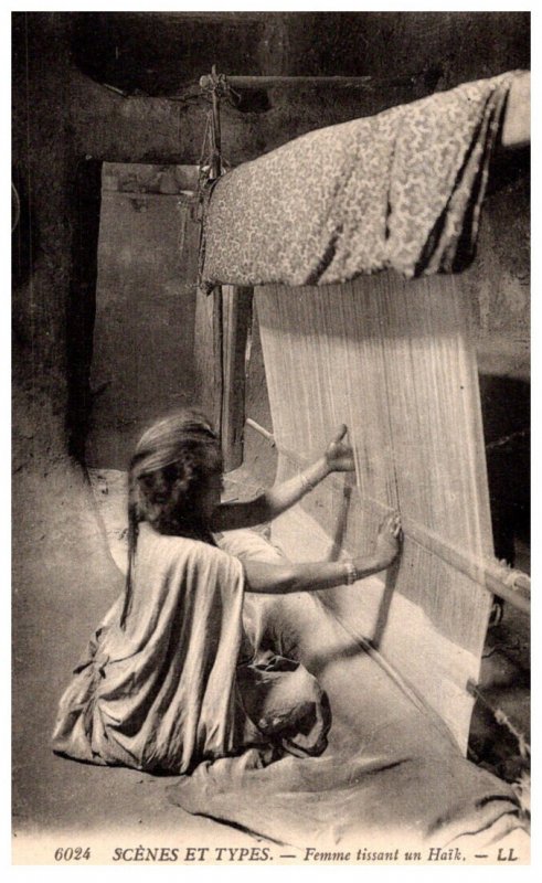 Girl using a  weaving machine