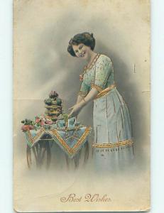 Pre-Linen art nouveau WOMAN PUTS ANTIQUE TEACUPS AND TEAPOT ON TABLE HJ3970