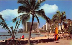 Honolulu Hawaii~Waikiki Beach Scene~Man in Pink Shorts Holding Surfboard~1960s
