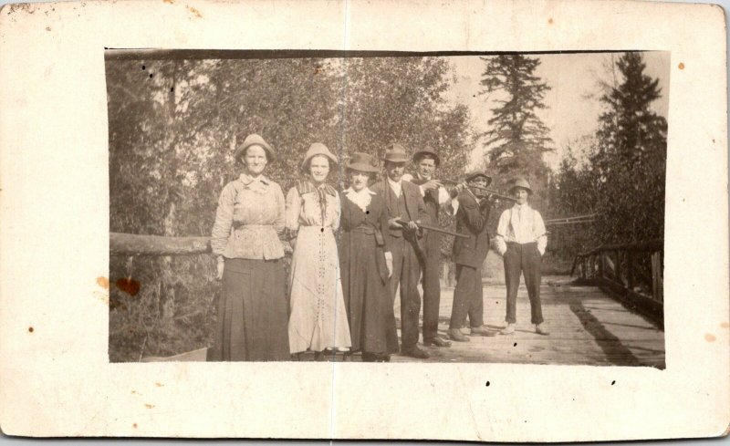 VINTAGE POSTCARD HUNTERS RIFLES AND SPOUSES AT ST. JOSEPH'S ISLAND ONTARIO RPPC