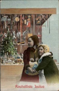 Rouhallista Joulua Christmas Little Girls Outside Toy Store Vintage Gel Postcard