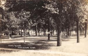 Hazleton Iowa~Park Scene~Tennis Court~Sign on Tree~Boys in Distance~1950s RPPC