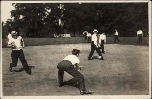 Men in Skimmer or Boater Hats Playing Baseball Game Action Scene c1910 RPPC