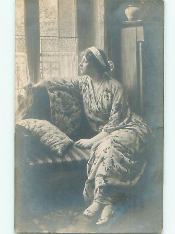 rppc 1914 Painting On Postcard WOMAN SITS ON COACH AT WINDOW AC8479