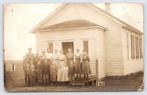 RPPC Postcard School Children in front of One Room Schoohouse with Teacher  P3