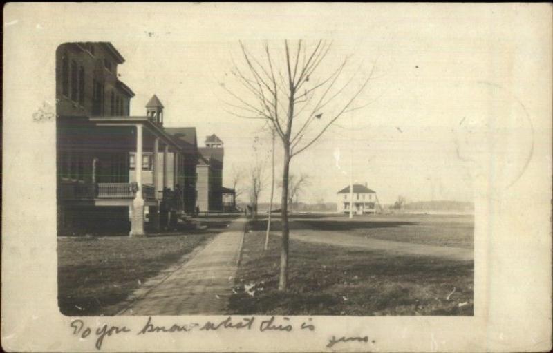 Homes & Sidewalk - Tomah WI Written on Back - Cancel? Real Photo Postcard 1905