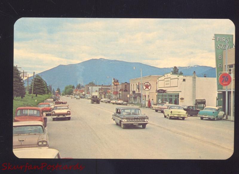 THOMPSON FALLS MONTANA 1960's CARS DOWNTOWN STREET SCENE VINTAGE POSTCARD