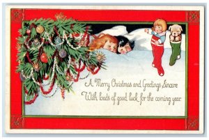 c1910's Christmas Greetings Sleeping Children Stockings Toys Embossed Postcard