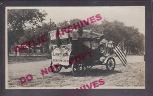Geneva NEBRASKA RPPC c1910 LAND COMPANY Parade ADVERTISING Real Estate FLAG!! NE