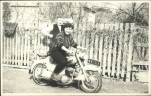 Woman on Motorcycle - Visible Shield Emblem Brand? Real Photo Postcard