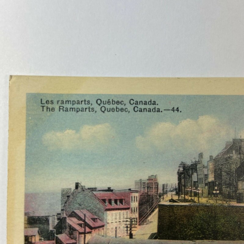 The Ramparts Quebec Canada Colored Canons Building Postcard Vintage