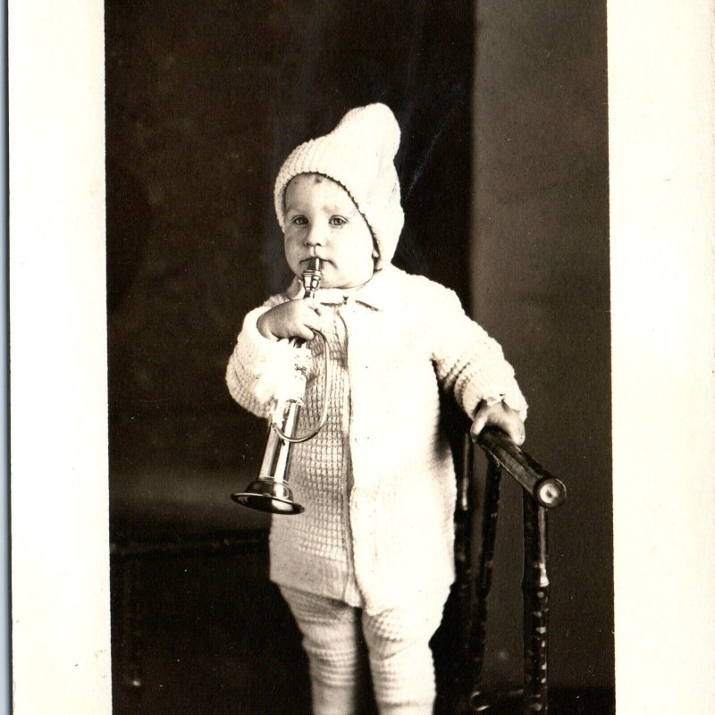 c1910s Adorable Baby w/ Trumpet RPPC Winter Cap Cute Musical Kid Real Photo A143