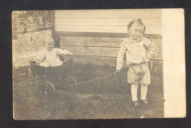 RPPC CUTE BOY PULLING TOY WAGON WITH BABY VINTAGE REAL PHOTO POSTCARD