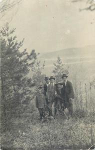 Real photo postcard young men with dog