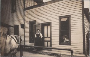 RPPC Postcard Woman looking Out of Doorway Waiting