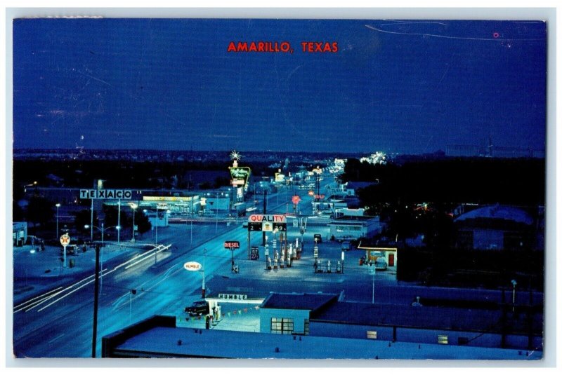 Amarillo TX, Night View Tourist Center Texaco Gas Station Holiday Inn Postcard
