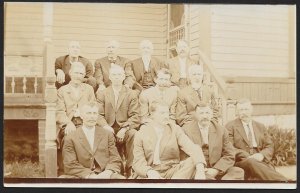 Twelve Men in Suits Sitting on Porch Steps RPPC Unused c1910s