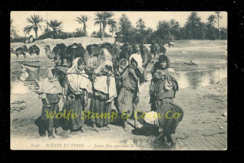 1920's Printed Photo Postcard Young African Girls Getting Water Camels B2252