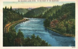 VINTAGE POSTCARD RAILROAD ALONG THE RIVER IN THE HEART OF THE MOUNTAINS SCENIC