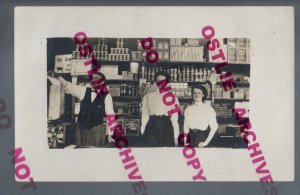 Hutchinson MINNESOTA RPPC 1910 INTERIOR GENERAL STORE Advertising WOMAN CLERK MN