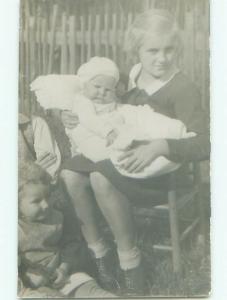 circa 1910 rppc CUTE LITTLE GIRL HOLDING BABY o2671