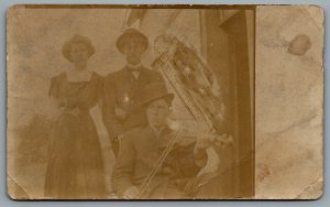 Postcard RPPC c1915 Photo Of Three People Man Playing Violin