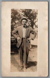 Postcard RPPC c1910s Unknown Location Man Arms on Waist Wearing Bow Tie & Hat