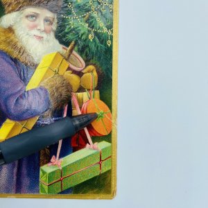 1910 Purple Robe Santa Claus Christmas Presents Tree Border Embossed Postcard