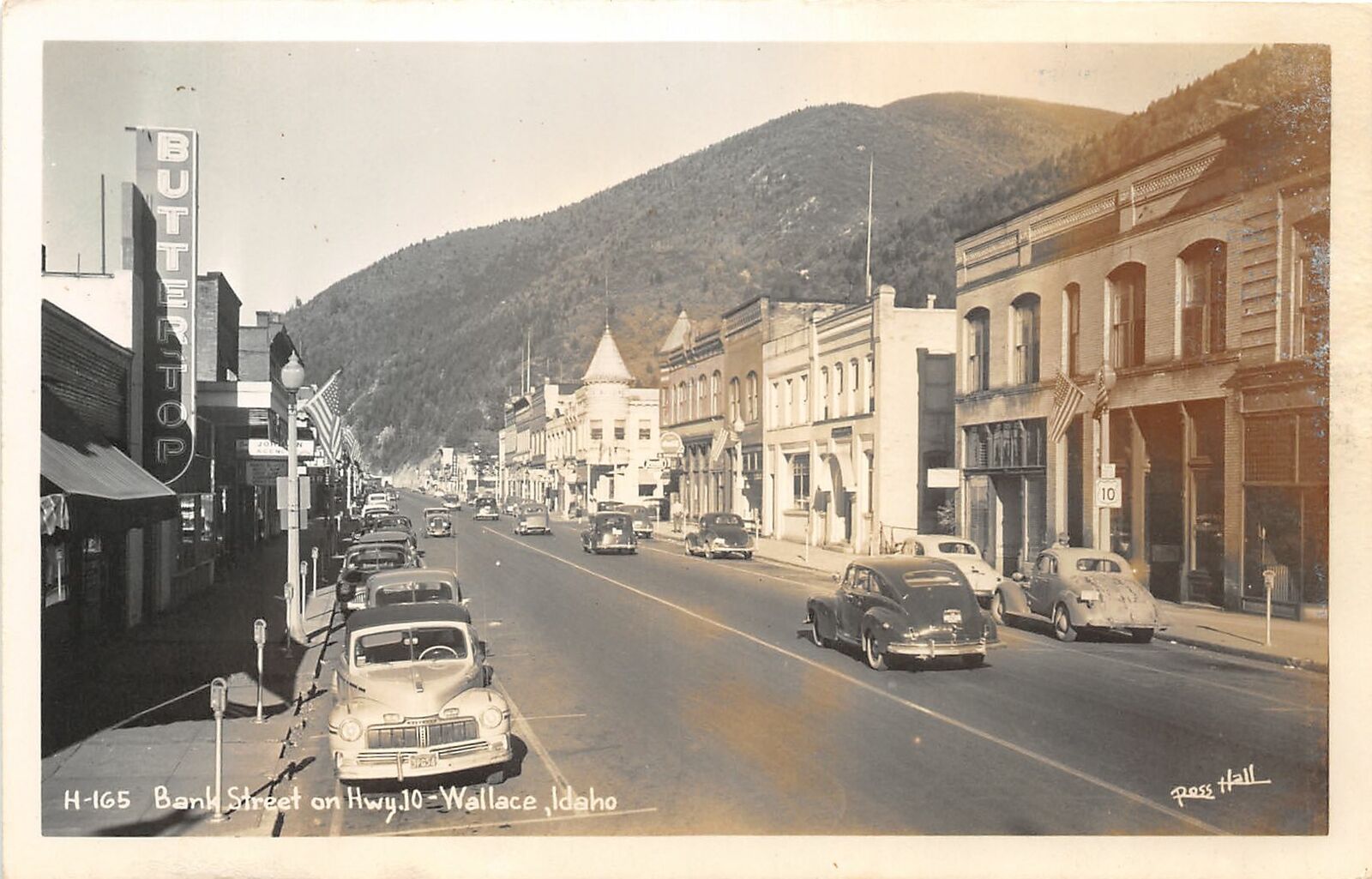 G46/ Wallace Idaho RPPC Postcard c1950s Bank Street Hwy 10 Stores Autos