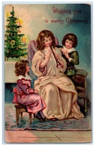 c1910's Christmas Tree Angel Playing Oboe Clarinet Candle Embossed Postcard