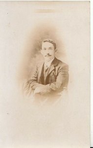 Ancestors Postcard - Real Photo of a Man Stood Against a Chair - TZ12321