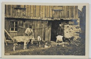 Switzerland RPPC Barn Scene Goats Cow Old Stone Wood Barn & People Postcard Q9