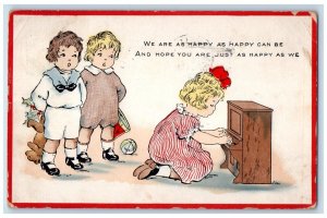 1915 Christmas Little Girl Playing Piano Holly Toys Springfield MA Postcard