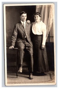 Vintage 1910's RPPC Postcard Studio Portrait Man Sitting Woman Standing