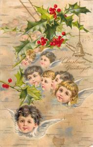 Christmas Greeting Children Heads Angels Holly Bells Antique Postcard K18620