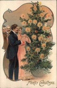 Family Christmas 1 of 4 Beautiful Woman Handsome Man Decorating Tree c1910 PC