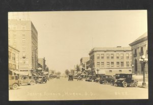 RPPC HURON SOUTH DAKOTA DOWNTOWN STREET SCENE OLD CARS REAL PHOTO POSTCARD