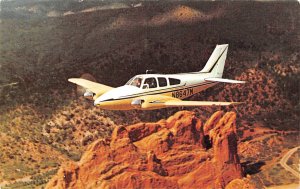 Beechcraft B55 Baron Twin Engine Plane over Garden of Gods Colorado postcard