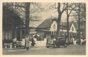 Postcard RPPC 1930s Holland Bicycles Street Lisse automobile TR24-207