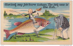 Having my picture taken, The big one is the fish, Little bald man holding fis...