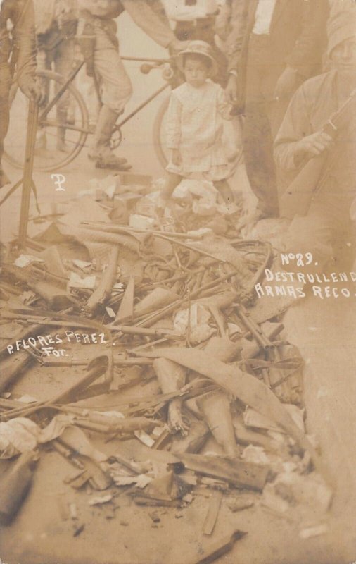 MEXICO~DESTRUYENDO ARMAS RECO~P. FLORES PEREZ-GUNS-BICYCLE~REAL PHOTO POSTCARD 