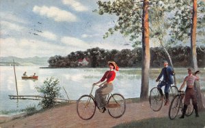 MEN & WOMEN BICYCLE BESIDE LAKE-1914 Friedrich Eyfried PUBLISHED ARTIST POSTCARD