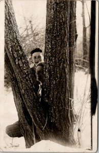 RPPC Young Men Peeking Behind Tree Snow Scene Rustic Woods Scene Postcard U12