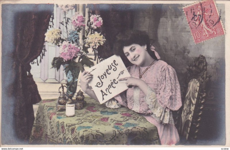 RP; NEW YEAR, 1900-10s; Joyeuse Annee, Woman pointing to sign sitting at tabl...